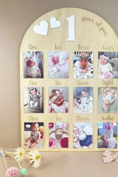 a wooden photo frame with pictures and hearts on the front, one year after birth