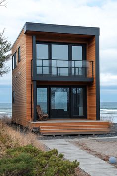 a modern house on the beach with an ocean view