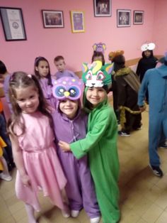 children in costumes are posing for the camera