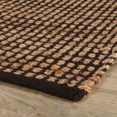 a brown and black rug on the floor