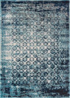 a blue and white rug with an intricate design