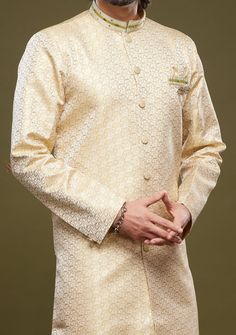 Ready-Made Sherwani With Aligarhi Trouser. All Over Jacquard Brocade Style Fabric Top. Art Silk Aligarhi Ready Made Trouser. Crafted in Chinese Collar Neck, and Full Sleeve. Satin Lining with Plain Work. High-Quality Matching Buttons. Please Note: The footwear shown in the picture is for presentation and photography purpose only. Color: There might be slight color variation due to lightings and flashes while photo shooting. The color may also vary because of different screen resolutions. Wash Ca Eid Bandhgala With Resham Embroidery In Art Silk, Formal Long Sleeve Bandhgala With Cutdana, Long Sleeve Traditional Wear With Cutdana For Eid, Elegant Long Sleeve Kurta With Zari Weaving, Long Sleeve Traditional Wear With Naqshi For Transitional Season, Brocade Sherwani With Naqshi For Diwali, Diwali Brocade Sherwani With Naqshi Details, Diwali Brocade Sherwani With Naqshi, Transitional Long Sleeve Traditional Wear With Naqshi