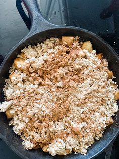 a frying pan filled with food on top of a stove