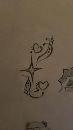 two drawings of hearts and stars on a sheet of paper with the letter s in it