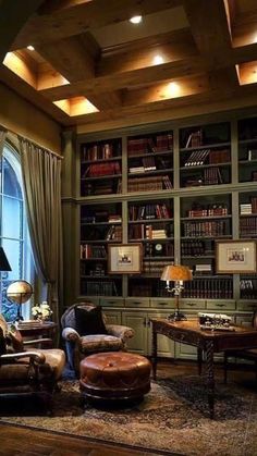 a living room filled with lots of furniture and bookshelves next to a window