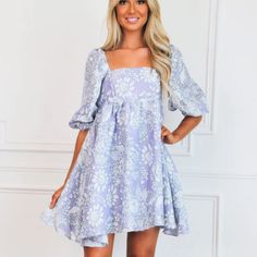 Such A Cute Fit White Dress With Purple Flowers, Spring Purple Puff Sleeve Dresses, Purple Puff Sleeve Mini Dress For Spring, Lavender Floral Print Mini Dress, Purple Puff Sleeve Mini Dress For Brunch, Lavender Sundress For Garden Party, Lavender Cotton Dress For Garden Party, Lavender Floral Print Short Sleeve Dress, Cute Purple Mini Dress For Spring