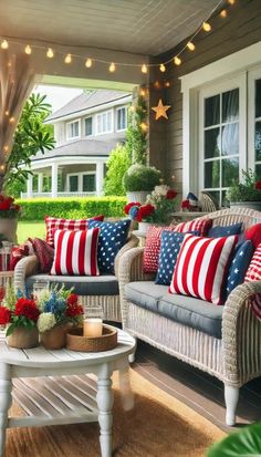 an outdoor living room with red, white and blue pillows