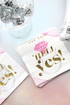 two napkins that say she said i'm still yes with gold foil on them