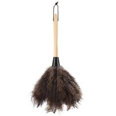 a brown feather duster hanging from a hook