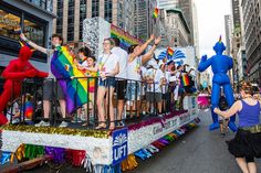 people on a float in the street during a parade