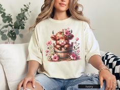 This cute highland cow design on a Comfort Colors T-shirt is perfect for animal lovers and nature enthusiasts. The pink flowers add a touch of whimsy to the design, creating a relaxed and charming vibe. It's a great addition to a casual outfit for a day out or a cozy night in. Ideal for those who appreciate the beauty of animals and flowers, this tee is perfect for spring and summer occasions. Product features - Available in sizes S to 4XL for a perfect fit - Double-needle stitching for durability - Garment-dyed fabric for soft color and texture - Made with 100% ring-spun US cotton for comfort - Relaxed fit and crew neckline for versatile styling Care instructions - Machine wash: cold (max 30C or 90F) - Do not bleach - Tumble dry: low heat - Iron, steam or dry: low heat - Do not dryclean Cute Highland Cow, Animals And Flowers, Cow Design, Cow Gifts, Cow Shirt, Cute Cow, Cozy Night, Cute Cows, Highland Cow