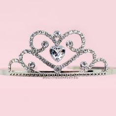 This Is A Brand New With Tags Silver Heart Princess Tiara. This Beautiful Tiara Features A Heart Motif, Silver Toned Hardware, And Sparkling Glass Rhinestones. Primark Exclusive! Size: Girls Os All Orders Are Packaged With And Are Shipped Out Asap! Questions? Leave Us A Comment! We Are More Than Happy To Help! New To Poshmark? Use The Invite Code Dailyshopper73 When You Create Your Account For $10 Off Your First Purchase! Beautiful Tiaras, Princess Tiara, Kids Hair Accessories, Girls Hair Accessories, Silver Heart, Kids Accessories, Tiara, Sparkle, Hair Accessories