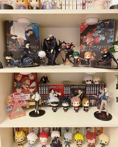 anime figurines and books on shelves in a room