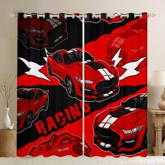 the curtains in this room are red and black with racing cars on them, as well as an arrow