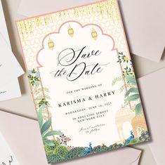 wedding save the date cards on top of envelopes and stationery with gold foil