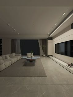 a large living room with white couches and a flat screen tv mounted on the wall