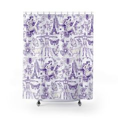 a shower curtain with purple and white designs on it