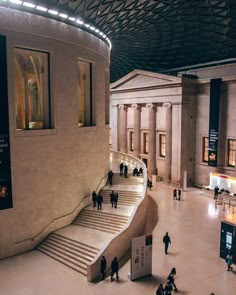 people are walking around in a large building