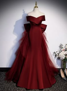 Silhouette:mermaidHemline:floor lengthNeckline:off the shoulderFabric:satin tulleShown Color:burgundySleeve Style:sleevelessBack Style:lace upEmbellishment:bowBuilt-in Bra: yes Formal Red Dress Long, Witch Wedding Dress, Wine Red Wedding Dress, Red Long Gown, Masquerade Prom Dress, Wine Red Prom Dress, Prom Dresses Off The Shoulder, Formal Dresses Graduation, Off Shoulder Evening Dress