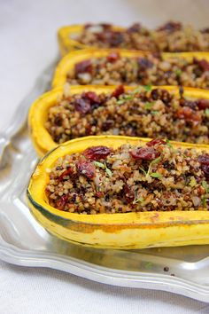 baked stuffed squash filled with stuffing on a glass platter