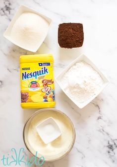 ingredients to make chocolate and vanilla ice cream on a marble counter top with text overlay