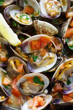 clams and other seafood are served in a bowl