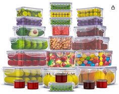 a stack of plastic containers filled with different types of fruits and vegetables in each container