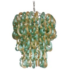 a green chandelier hanging from a chain