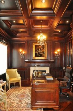 an office with wood paneling and chandelier above the desk is surrounded by chairs