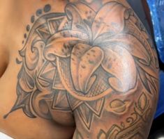 a close up of a person's chest with an elephant tattoo on it,