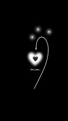 a black background with white lights and a heart