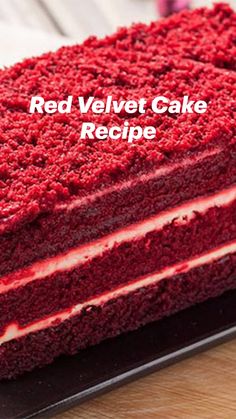 a red velvet cake is on a black plate