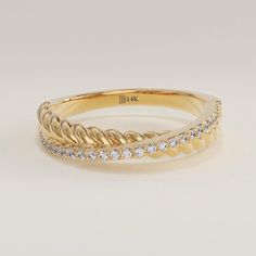 an 18k yellow gold ring with diamonds