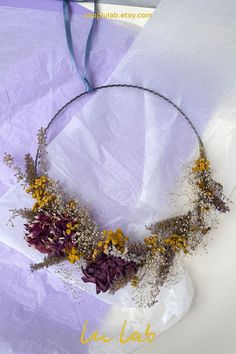 an image of a wreath made out of dried flowers