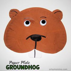 a paper plate groundhog mask with googly eyes