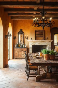 a dining room table with chairs and a chandelier hanging from it's ceiling