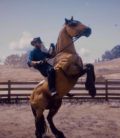 a man riding on the back of a brown horse