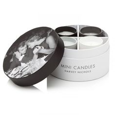 mini candles in a white box with black lid