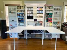 a white table sitting on top of a hard wood floor