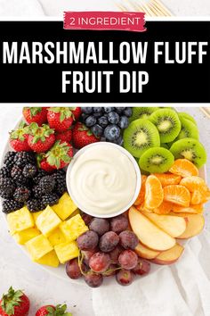 a white plate topped with fruit and dip