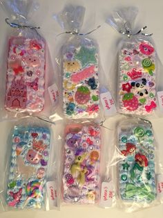 four bags filled with different types of buttons