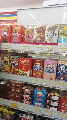 a store shelf filled with lots of different types of snacks