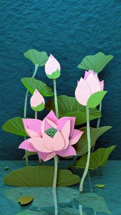 paper cut lotus flowers and leaves on green water with blue wall in the back ground