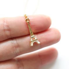 Beautiful and lovely gold Eiffel Tower necklace. Made of gold Eiffel Tower pendant with skinny gold plated brass chain.  A simple and soft look necklace is good for yourself or gift! Your necklace will ship in a gift box. * Gold Plated over Brass * Length available 14"-20"  * Pendant approx. 1/2" x 3/4"  * Creation Time: 1 - 3 days    ♥  See more Rudiana Accessories  Rudiana.etsy.com Eiffel Tower Gold Necklace, Gold Eiffel Tower, Eiffel Tower Necklace, Brass Chain, Gift Birthday, Wedding Shop, Graduation Gifts, Eiffel Tower, Charm Necklace