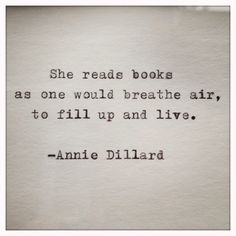 an old typewriter with the words she reads books as one would breathe air, to fill up and live