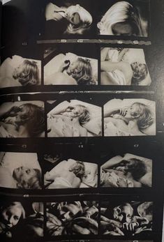 black and white photograph of woman laying in bed with multiple pictures on the wall behind her