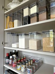 an organized pantry with lots of food and condiments in clear containers on the shelves