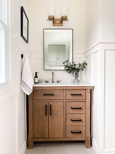 a bathroom with a sink and mirror in it