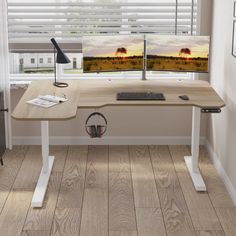 a computer desk with two monitors and headphones on it in front of a window