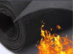 a roll of black mesh fabric with flames coming out of the top and bottom part